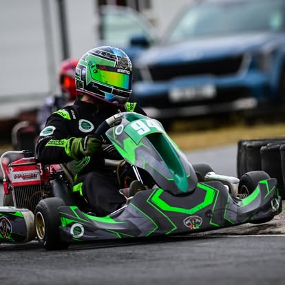 Driver 96 in the green TLR kart on track